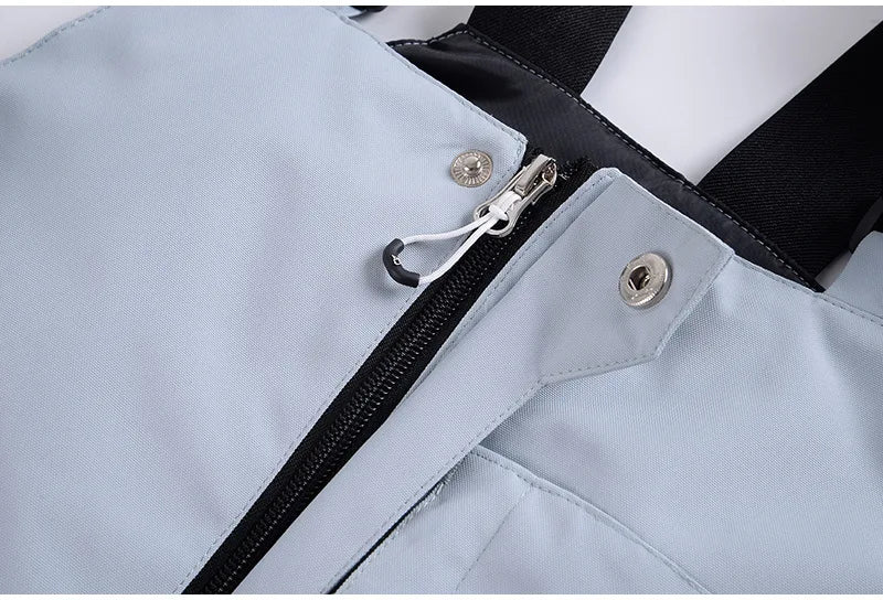 Traje de esquí para hombre y mujer, chaqueta de esquí impermeable a prueba de viento y pantalones con correa, traje cálido de invierno para pareja, novedad de 2023