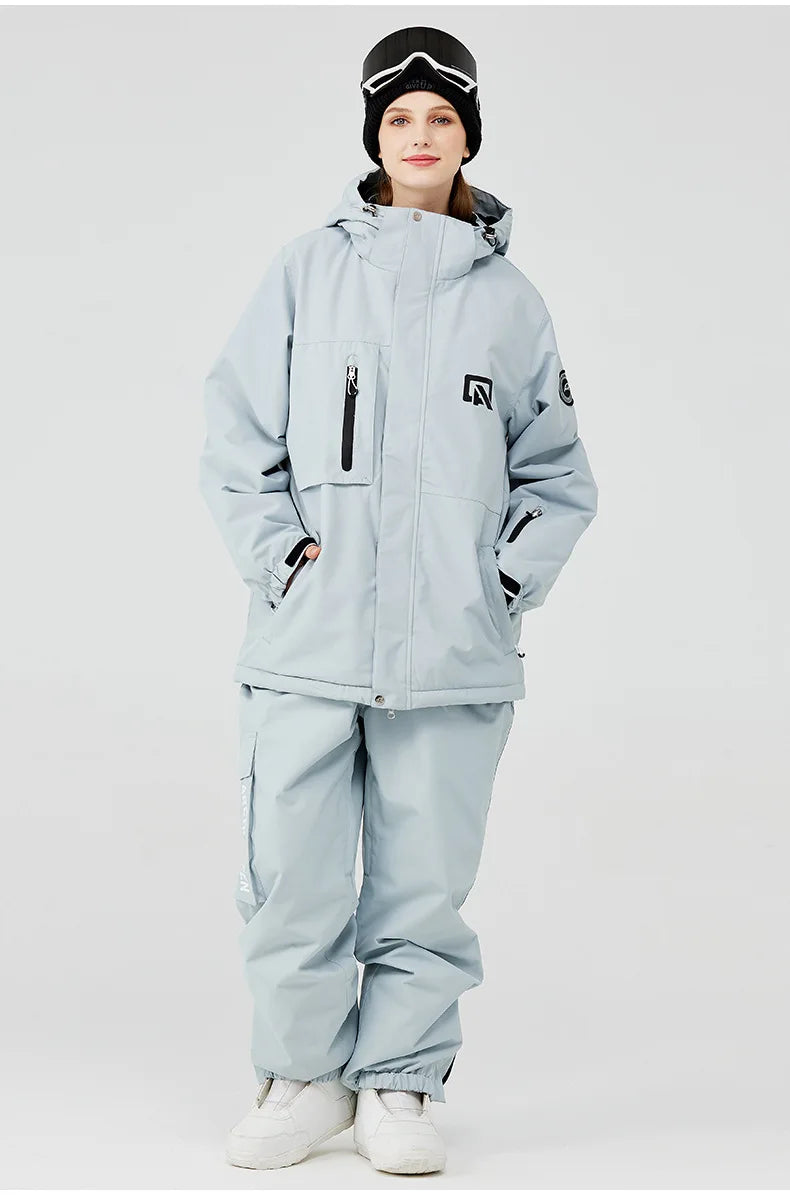 Traje de esquí para hombre y mujer, chaqueta de esquí impermeable a prueba de viento y pantalones con correa, traje cálido de invierno para pareja, novedad de 2023